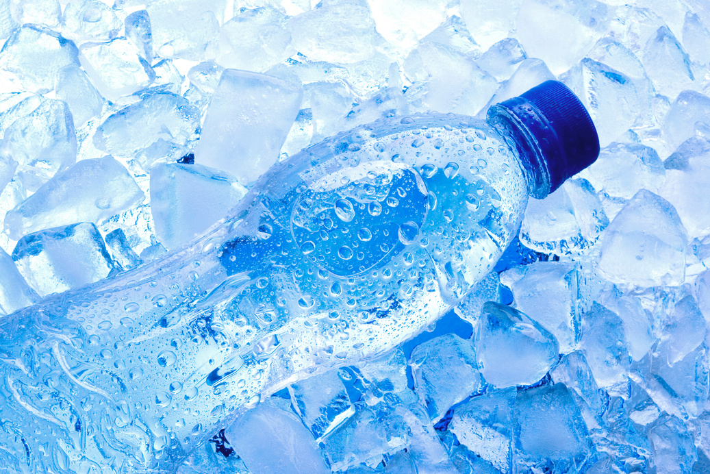 Bottled water with ice cubes